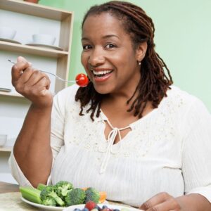a woman eating healthy foods