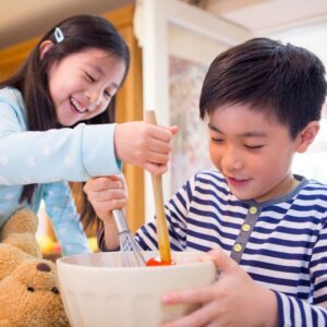 children mixing and whisking in a bowl