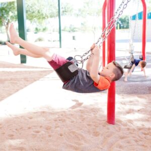 children swinging at a playground