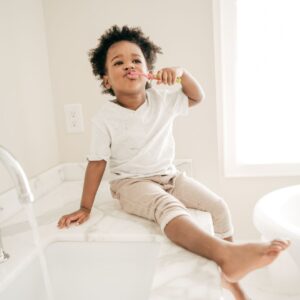 a child brushing their teeth