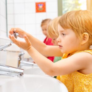 img of a kids washing her hands